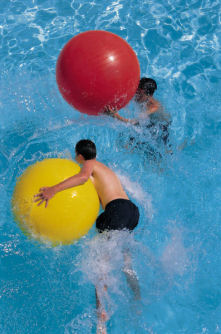 Boys playing hard in pool